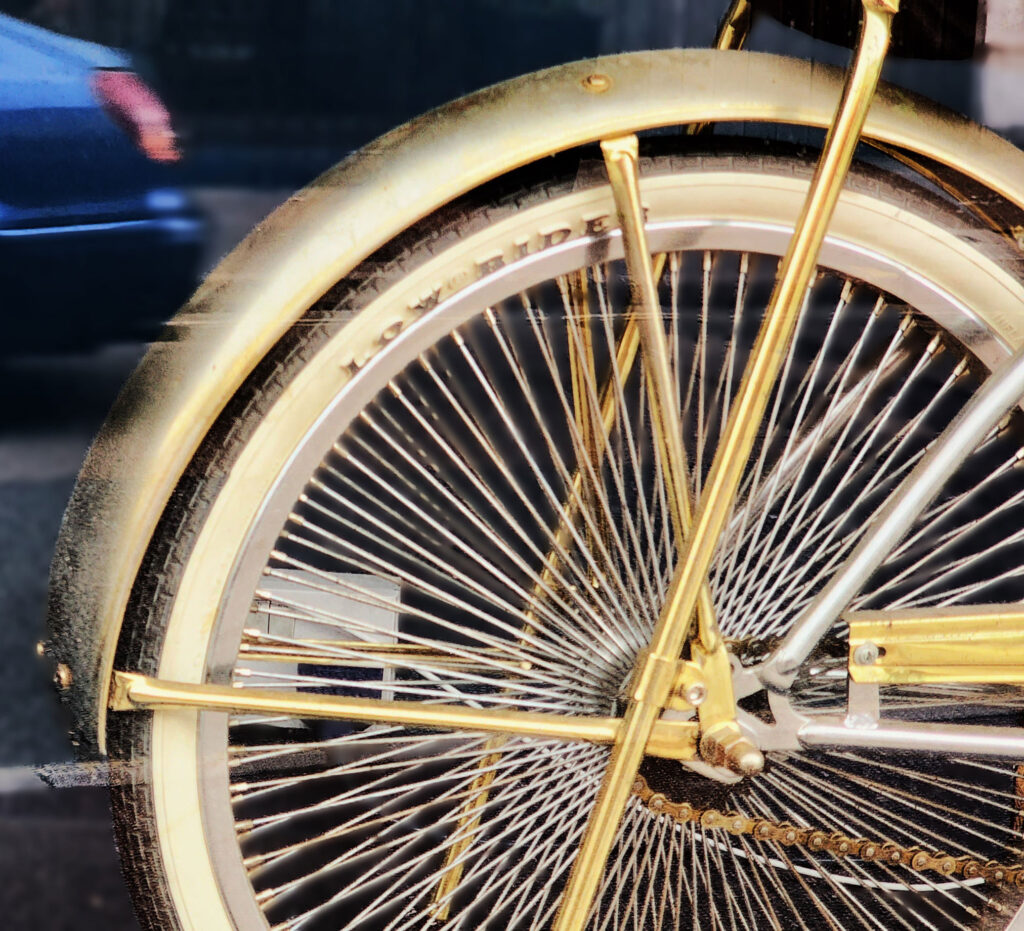 Gold bike blue car - Alan Hillman